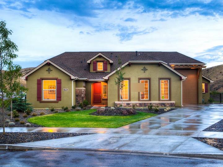Example photo: a house with a driveway and planted beds